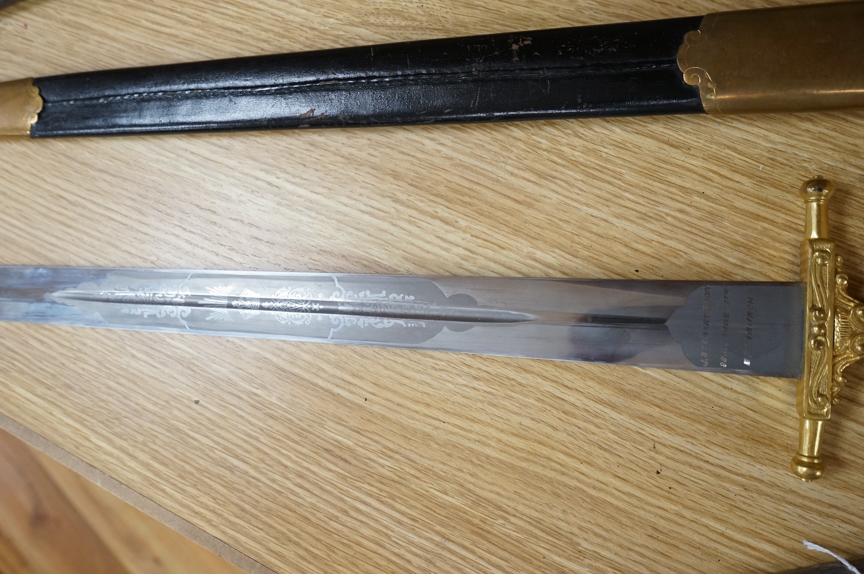 A Scottish sidearm for the King’s Own Bodyguard for Scotland, straight blade by J. Stewart and Son, etched and polished regulation blade, ormolu hilt, in its leather scabbard with ormolu mounts (gilding worn to mounts)
